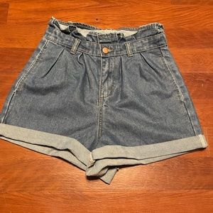 Women’s nasty gal 80s style denim mom shorts with ruffled cinched waist detail.